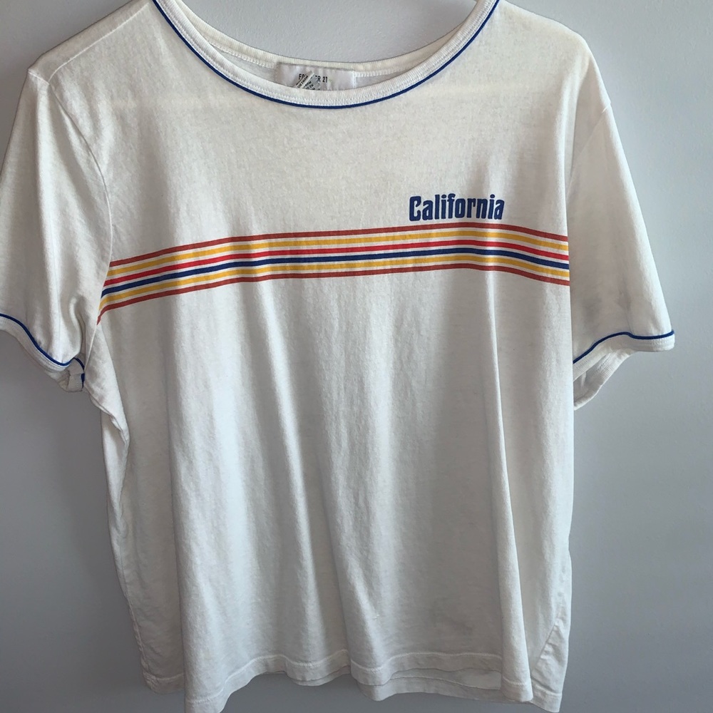 White T-shirt with some colors.
